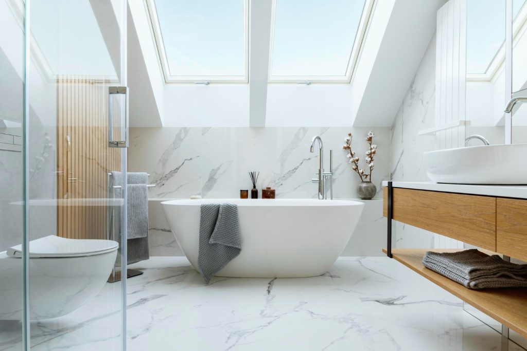 stylish bathroom interior design with marble panels bathtub towels other personal bathroom accessories modern glamour interior concept roof window template